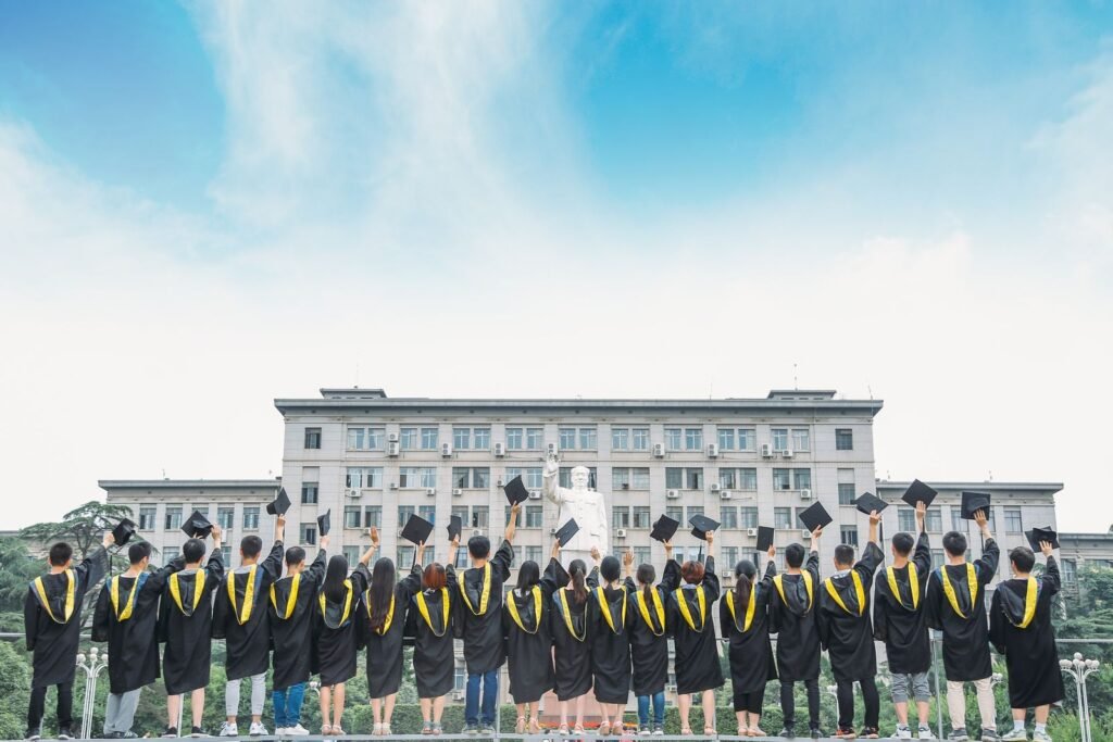 Graduates celebrating with caps in the air
