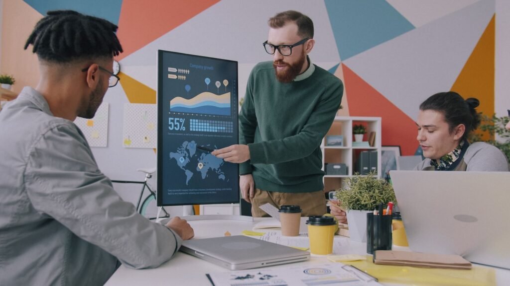 Team analysing enrollment growth charts in a meeting