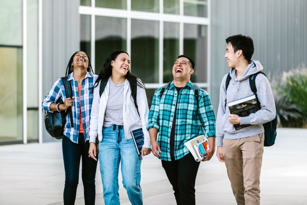 Group of university students walking together on campus